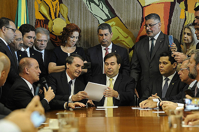 President Bolsonaro hands over proposed pension reform to the president of Brazil's lower house, Rodrigo Maia