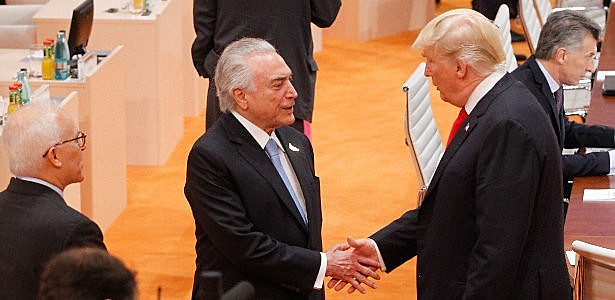 Brazilian President Michel Temer greets U.S. President Donald Trump