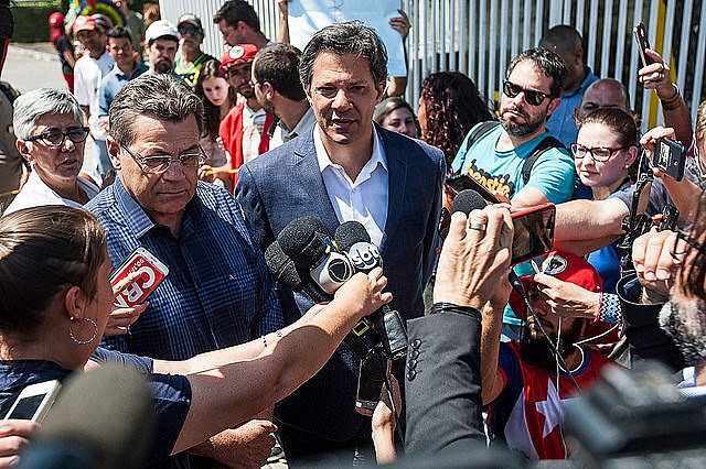 Fernando Haddad (center), who replaced ex-president Lula as the Workers’ Party presidential candidate, speaks to journalists
