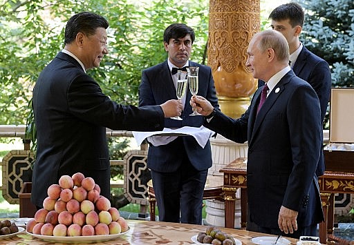 Presidente da China Xi Jinping e presidente da Rússia Vladimir Putin em encontro em junho na Ásia