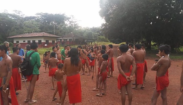 Fearing armed attack, indigenous villagers fled from their homes to nearby Aramirã