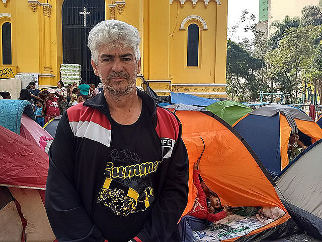 A survivor of the fire, Adilson da Silva is camping outside a church with his family and fears authorities might forget about them