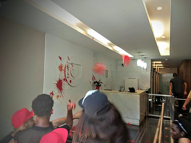 Protesters from Levante Popular stained the chanel’s signboard with red paint
