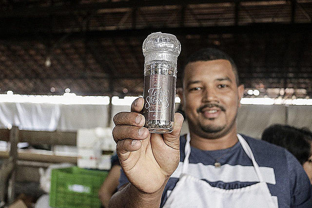 Landless worker Roberto Silva from Espírito Santo state shows pepper of brand Terra de Sabores, produced in the Valdício Barbosa settlement