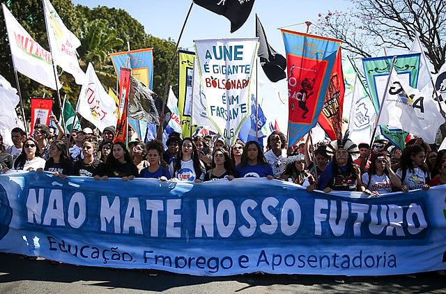 Students protested against education budget cuts and proposed pension reform during the last UNE Congress, in July