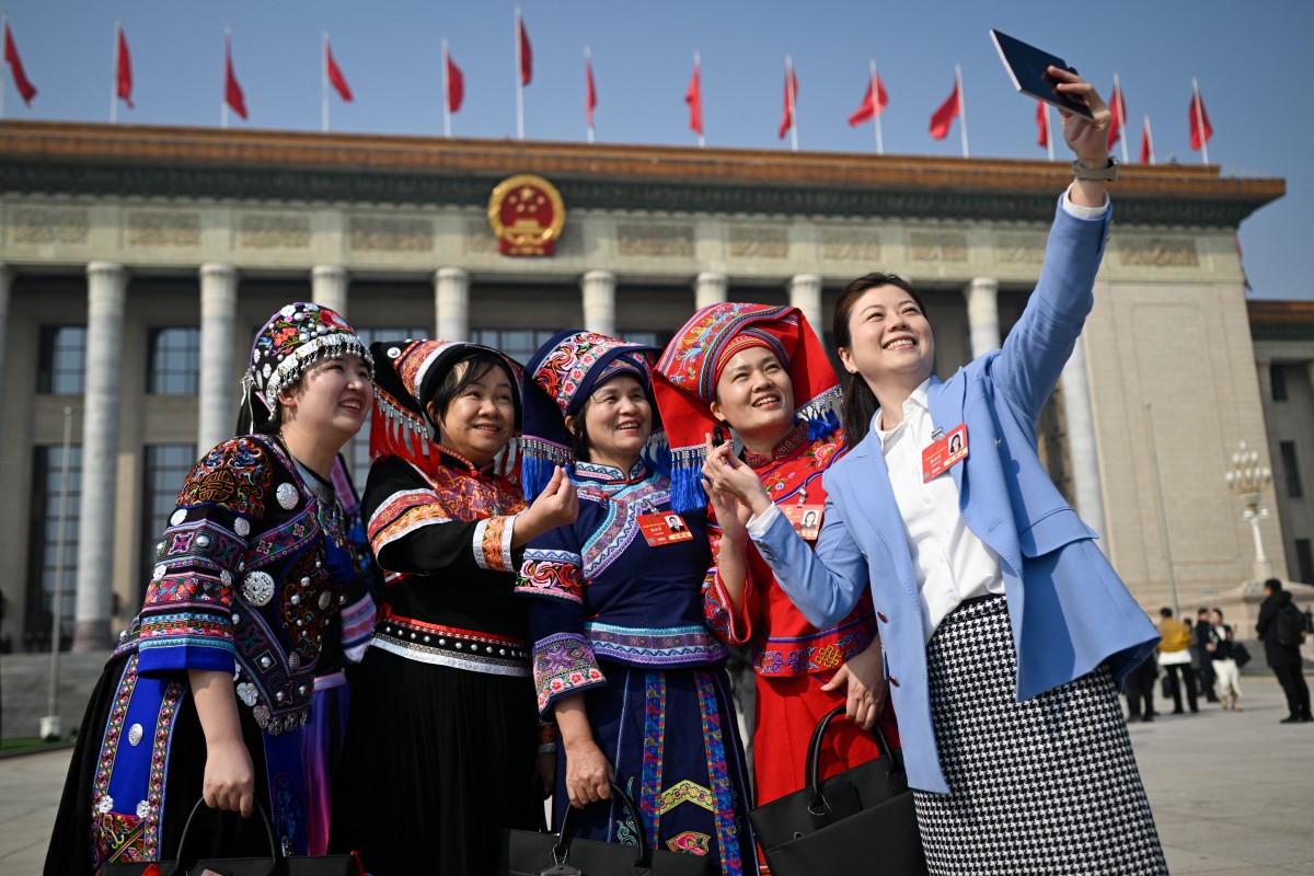 Delegates after the plenary session of the National People's Assembly at the Great Hall of the People in Beijing, March 8, 2025. Wang Zhao/ AFP