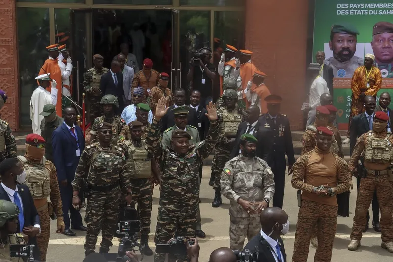 Leaders of the military governments of Niger, Abdourahamane Tiani (center), Mali’s Assimi Goïta (third from right), and Burkina Faso’s Ibrahim Traoré (second from right)