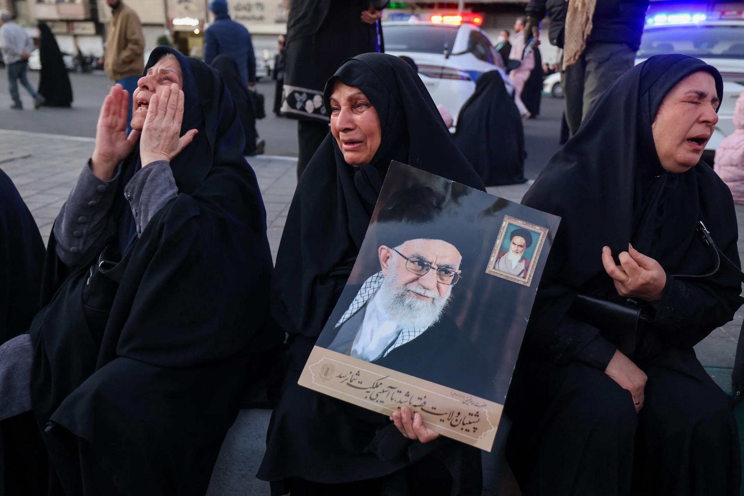 People mourn the death of Irans supreme leader Ayatollah Ali Khamenei, who was killed in joint US and Israeli strikes, at a square in Tehran on March 1, 2026. Ayatollah Ali Khamenei, Iran's supreme leader since 1989 and sworn enemy of the West, was killed in the opening salvo of a massive US and Israeli attack that extended into a second day on March 1, as the two powers seek to topple the Islamic republic. (Photo by ATTA KENARE / AFP)