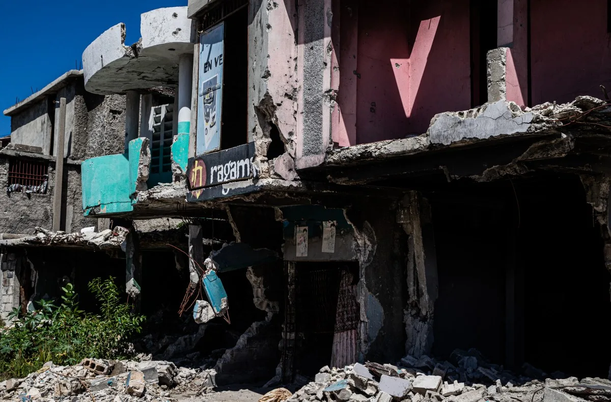 Debris and rubble are piled along houses destroyed by armed gangs in 2024 in the Solino neighborhood of Port-au-Prince, Haiti, on March 3, 2026. Haiti's presidential transitional council, which has run the impoverished Caribbean nation for nearly two years, on February 7, 2026, handed power to US-backed Prime Minister Alix Didier Fils-Aime, after failing to rein in rampant gang violence. Rubio said in February he was upbeat about progress in setting up a new UN-blessed force to suppress Haiti's powerful gangs and voiced hope that the country will finally hold elections this year for the first time in a decade. (Photo by Clarens SIFFROY / AFP)