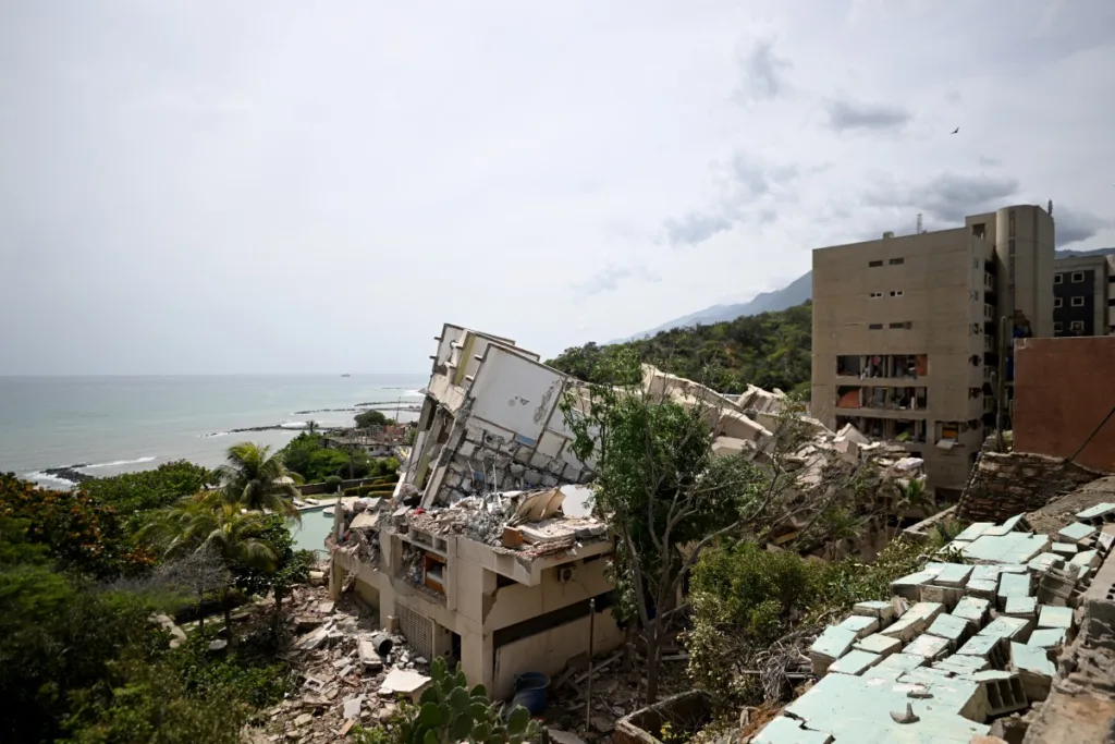 A view shows collapsed buildings on a hillside overlooking the sea after an earthquake in Catia La Mar, La Guaira state, about 30 km northwest of Caracas, on June 25, 2026.