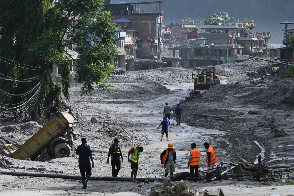 Rescue works continue at Trishuli Center in Nepal's Nuwakot district on August 30, 2026, after catastrophic flooding on the Nepal-Tibet border. The number of people missing in the catastrophic flood that sliced through the border area between Nepal and Tibet neared 3,000 on August 30, as rescuers scoured deep, leg-sucking mud for survivors. (Photo by Arun SANKAR / AFP)