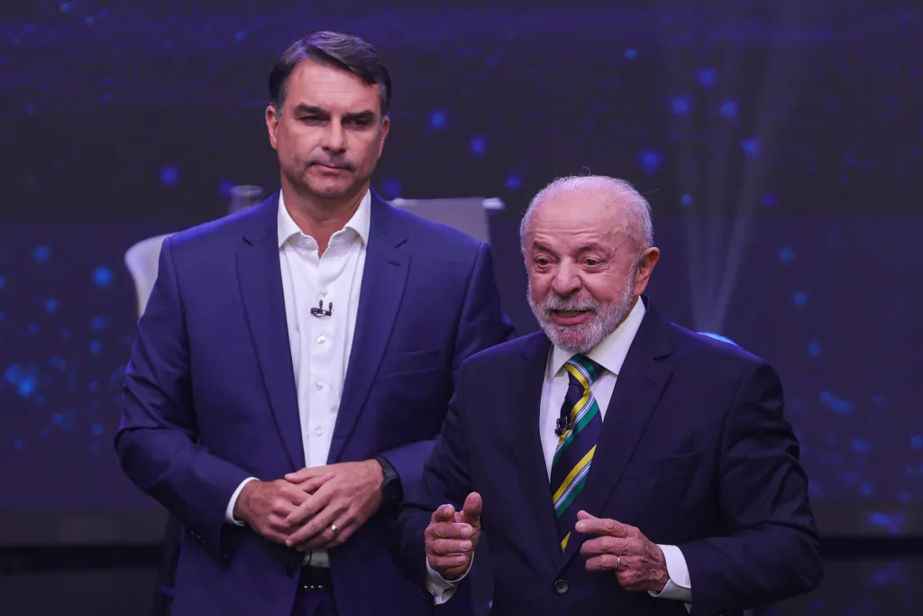 Brazilian President Luiz Inacio Lula da Silva and Senator Flavio Bolsonaro, presidential candidates, participate in a televised presidential debate hosted by Band TV in Sao Paulo, Brazil, on October 18, 2026, ahead of the presidential runoff election. (Photo by Allison Sales/NurPhoto) (Photo by Allison Sales / NurPhoto via AFP)