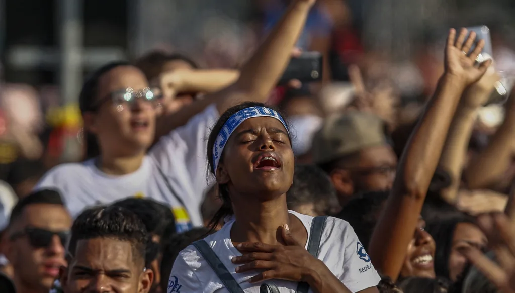 A woman attends the 27th edition of the "March for Jesus" to celebrate Corpus Christi, an event that gathers a wide range of evangelical congregations, in Sao Paulo, Brazil, on June 20, 2019. (Photo by Miguel SCHINCARIOL / AFP)