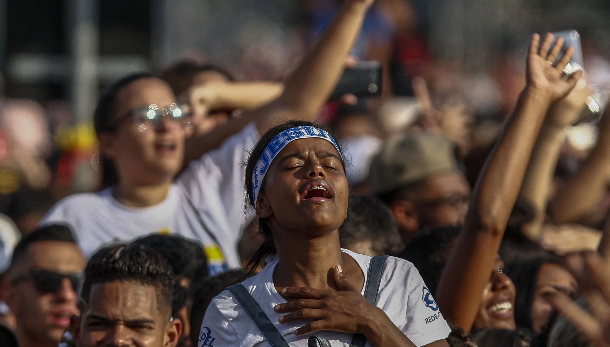 A woman attends the 27th edition of the "March for Jesus" to celebrate Corpus Christi, an event that gathers a wide range of evangelical congregations, in Sao Paulo, Brazil, on June 20, 2019. (Photo by Miguel SCHINCARIOL / AFP)