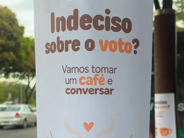 Cartaz do projeto Café com Diálogo convida pessoas indecisas sobre o voto a compartilhar um café e conversar